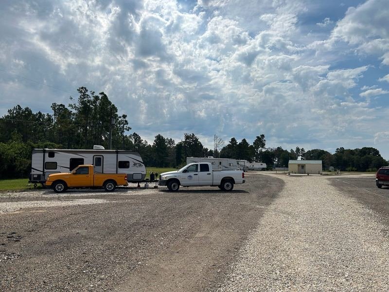 RVs and trucks parked at the sites